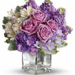 Reference # t50-2B
Starting at $ 48.95
Visions of sugar plum fairies dance to life with this magical bouquet. Lush lavenders, frosty whites and silvery greens look romantic and refreshing inside a cool cube vase.. Roses, delicate hydrangea and feminine stock make a cool collection .
