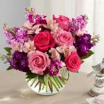 Reference # B20-4970
Starting at $ 49.99
 Hot pink and pink roses are brought together with purple, lavender and fuchsia stock stems accented with pink Peruvian lilies and lush greens to create a simply stunning flower arrangement. Presented in a clear glass bubble bowl vase,
