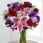 Reference  # C16-4839
Starting at $ 69.99 
rich red roses, lavender carnations, red Peruvian lilies, purple double lisianthus, purple matsumoto asters and lush greens. Presented in a classic clear glass vase, this elegant bouquet is an incredible way to convey your sweetest sentiments.