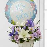 Reference # D7-4903
Starting at  $54.95
Lavender roses, blue iris, lavender carnations, lavender daisies, white Asiatic lilies and lush greens are beautifully arranged in a round whitewash basket. Presented with a Mylar balloon declaring, "It's A Boy!".
