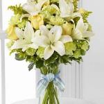  $Reference #  D7-4905D
Starting at $39.95
Yellow roses and carnations are brought together with pale green mini carnations, white Asiatic lilies, yellow solidago and lush greens exquisitely arranged in a clear glass gathered square vase. 
