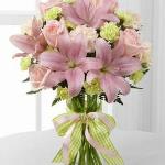 Reference #  D7-4906d
Starting at $39.99
Pink roses, pink Asiatic lilies, pale peach carnations, pale green mini carnations and lush greens are exquisitely arranged in a clear glass gathered square vase. Accented with a pink satin ribbon, this flower bouquet creates beautiful  gift.