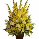 Reference # T219-1A
As shown $ 149.00

Bright yellow blooms such as roses, gladioli, button mums, daisies and solidago, accented by leatherleaf fern.
