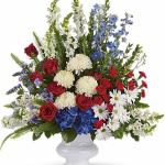 Reference # T240-1A
As shown $ 139.00
A classic all-American display of patriotic red, white and blue flowers pays tribute to the memory of one who proudly served his country, and is a testament to hope, freedom and strength.
