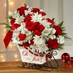 Reference  16-C4
Starting at 49.95
Ride into the season with a joyful burst of holiday blooms! A modern, fresh take on the traditional sleigh arrangement, we bring together red roses, red carnations, and red mini carnations, offset by snowy white Peruvian lilies and chrysanthemums.