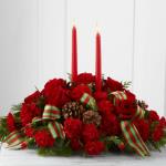 Reference # B15-4824
Starting at  $49.99
Bright red roses, carnations and mini carnations are arranged amongst an assortment of holiday greens, accented with natural pinecones and a designer red and green striped ribbon. 
