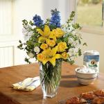 Reference # t58-1a
Starting at $ 54.95
Sunny yellow asiatic lilies and roses are blended with light blue delphinium, white stock, white roses and green button spray chrysanthemums in a clear glass Jewel Vase.
