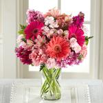 Reference #  C13-5166
Starting at $34.99
Coral and hot pink gerbera daisies captivate the eye surrounded by pink Peruvian Lilies, pink and hot pink gilly flower, pale pink carnations and mini carnations, and lush greens situated beautifully in a modern clear glass vase.