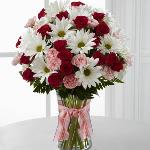 Reference # C12-4792
Starting at $ 39.00
Fuchsia spray roses, pink mini carnations, white traditional daisies and lush greens are sweetly situated in a classic clear vase accented with a perfectly pink designer ribbon. 
