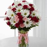 Reference # C12-4792
Starting at $ 39.00
Fuchsia spray roses, pink mini carnations, white traditional daisies and lush greens are sweetly situated in a classic clear vase accented with a perfectly pink designer ribbon. 
