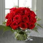 Reference # E6-5239
Starting at $ 89.99
Gorgeous red roses form a splash of color accented with loops of lily grass blades around the outside and the alluring textures of plumosa to draw the eye in. Presented in a clear glass cylinder vase lined with aspidistra leaves to create even further appeal.
