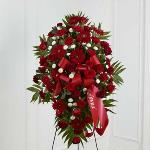 Reference # S14-4467
Standing Spray
An exceptional arrangement of red roses, burgundy carnations, burgundy mini carnations, red gerbera daisies and white button poms are accented with a variety of lush greens